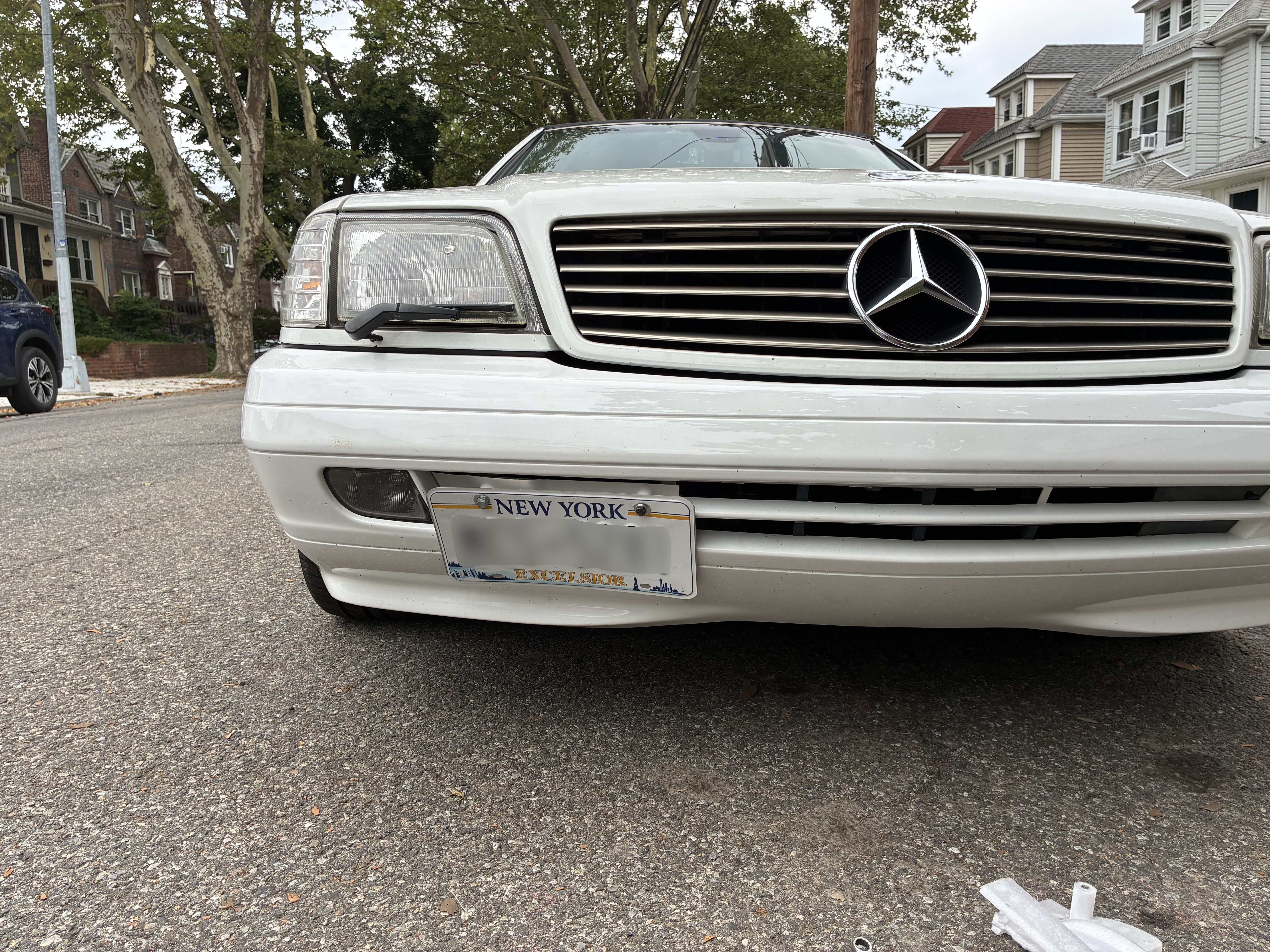 R129 Facelift Front Bumper Tow Hook Cover with License Plate Mount 1298800205 12988002059999 thumbnail