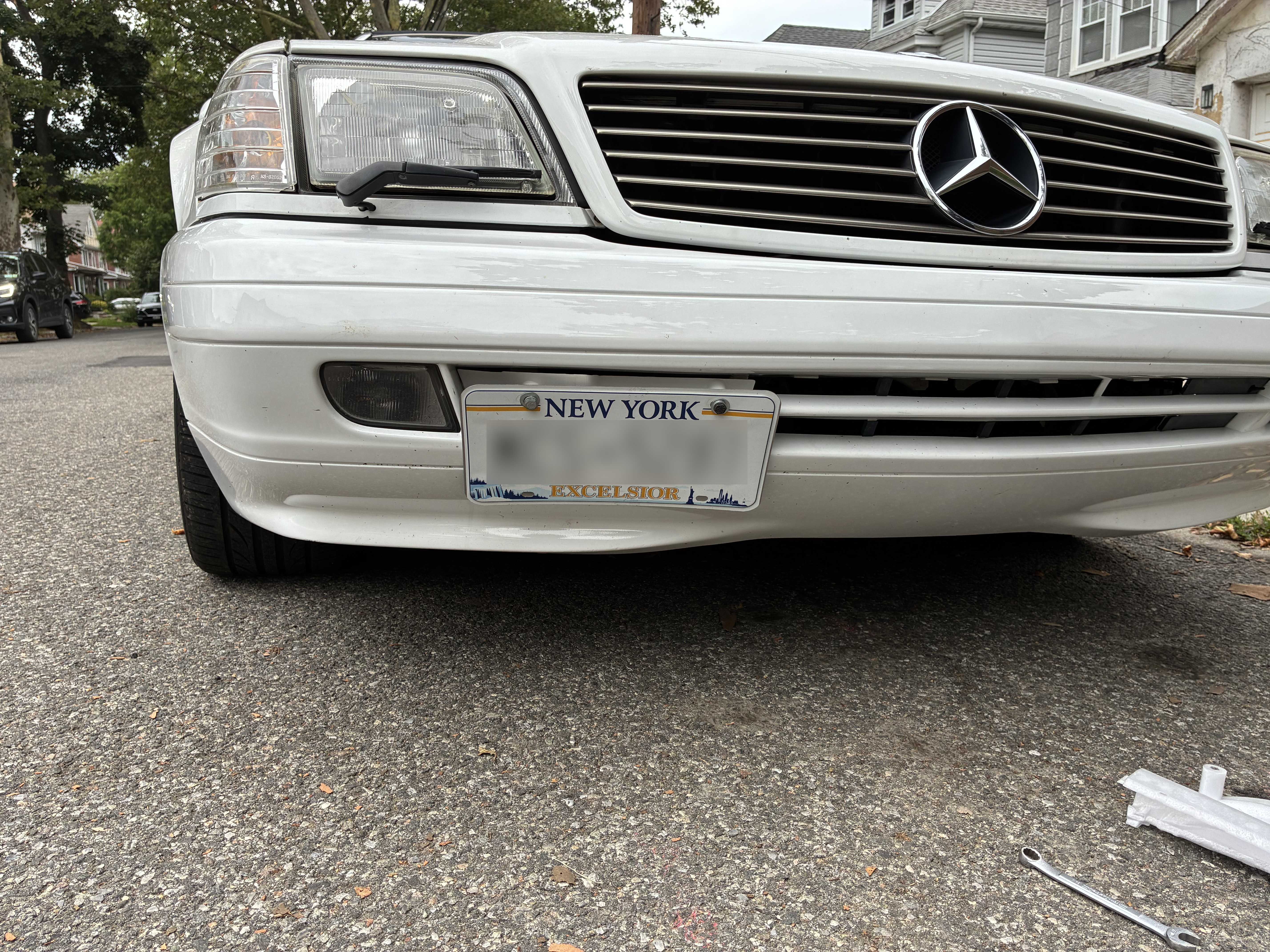 R129 Facelift Front Bumper Tow Hook Cover with License Plate Mount 1298800205 12988002059999 thumbnail