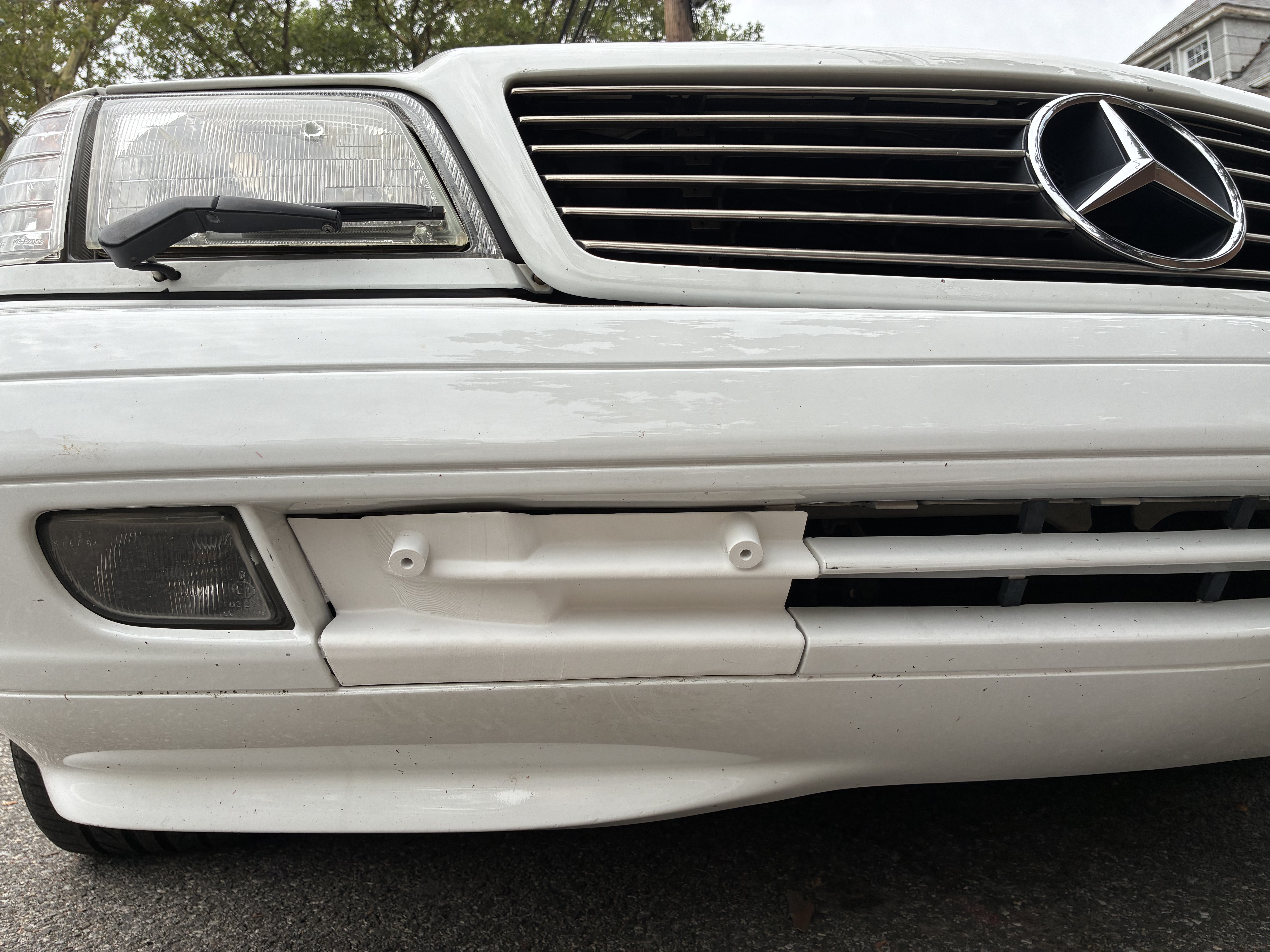 R129 Facelift Front Bumper Tow Hook Cover with License Plate Mount 1298800205 12988002059999 thumbnail