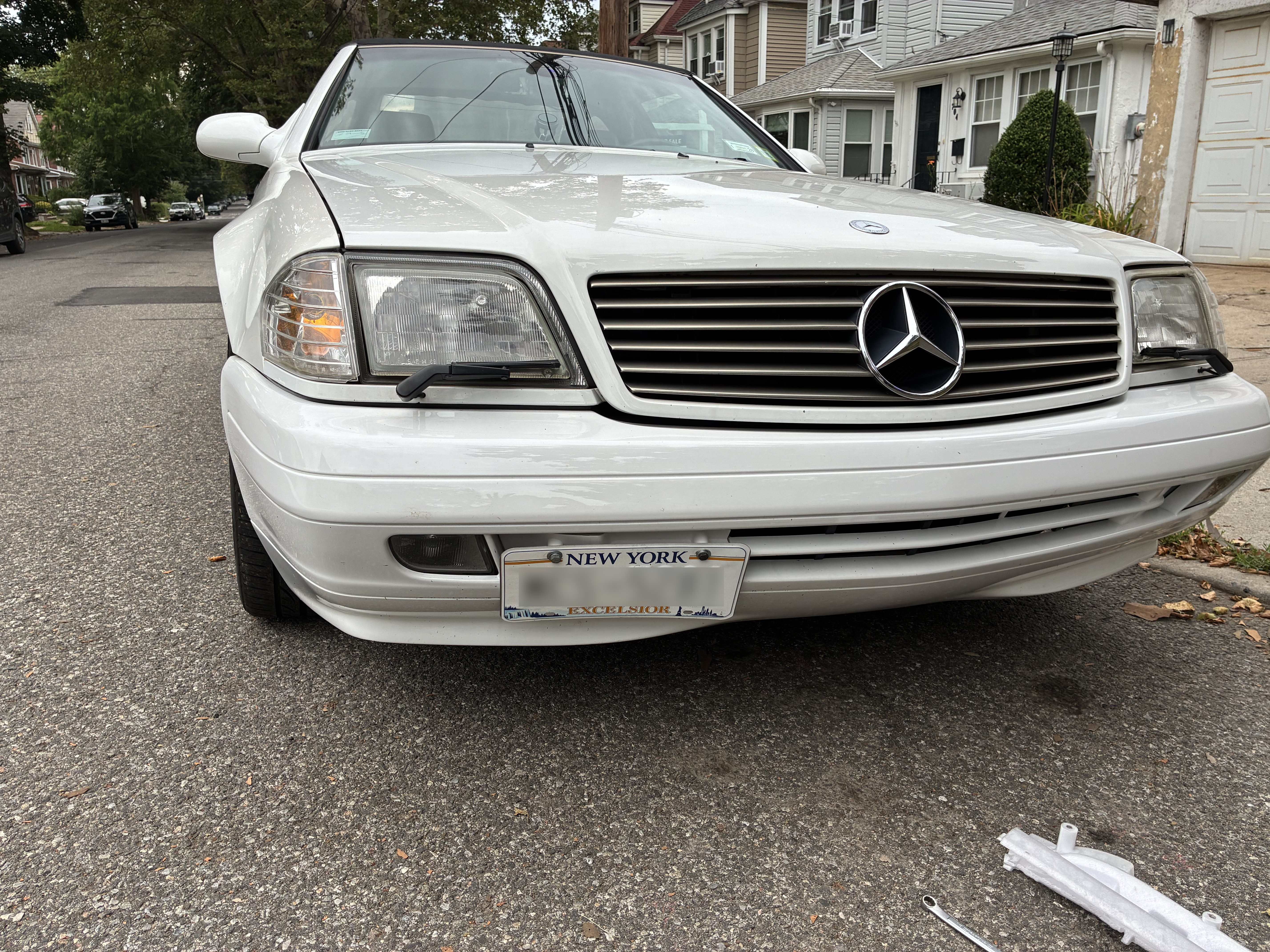 R129 Facelift Front Bumper Tow Hook Cover with License Plate Mount 1298800205 12988002059999 thumbnail
